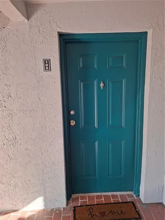 a view of a elevator with wooden door