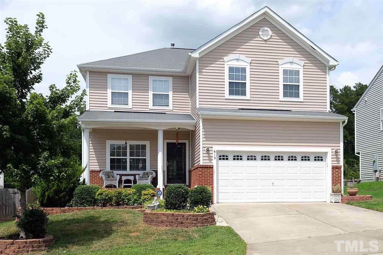 a view of house with yard