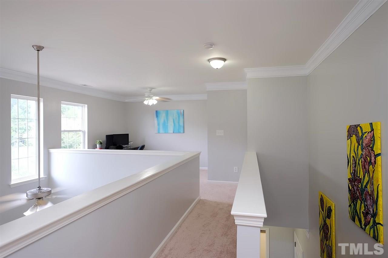 613 Hanson Road Durham, NC 27713 - Photo 13 of 25 a large white kitchen with a sink a window and stainless steel appliances