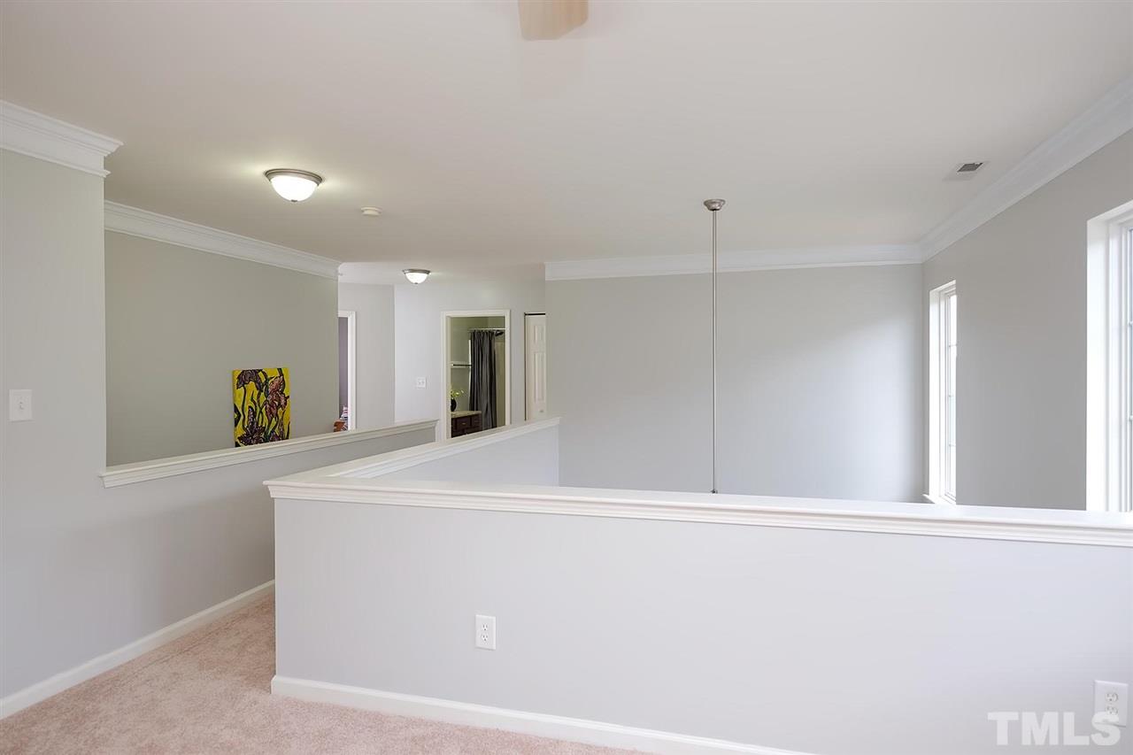 613 Hanson Road Durham, NC 27713 - Photo 15 of 25 a view of an empty room with wooden floor and a window
