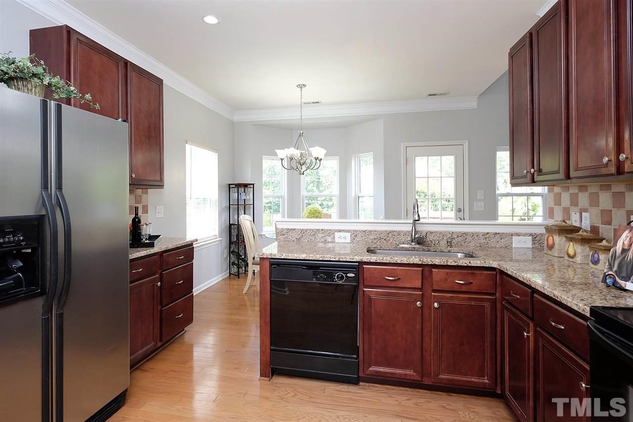 613 Hanson Road Durham, NC 27713 - Photo 5 of 25 a kitchen with a sink stove and refrigerator