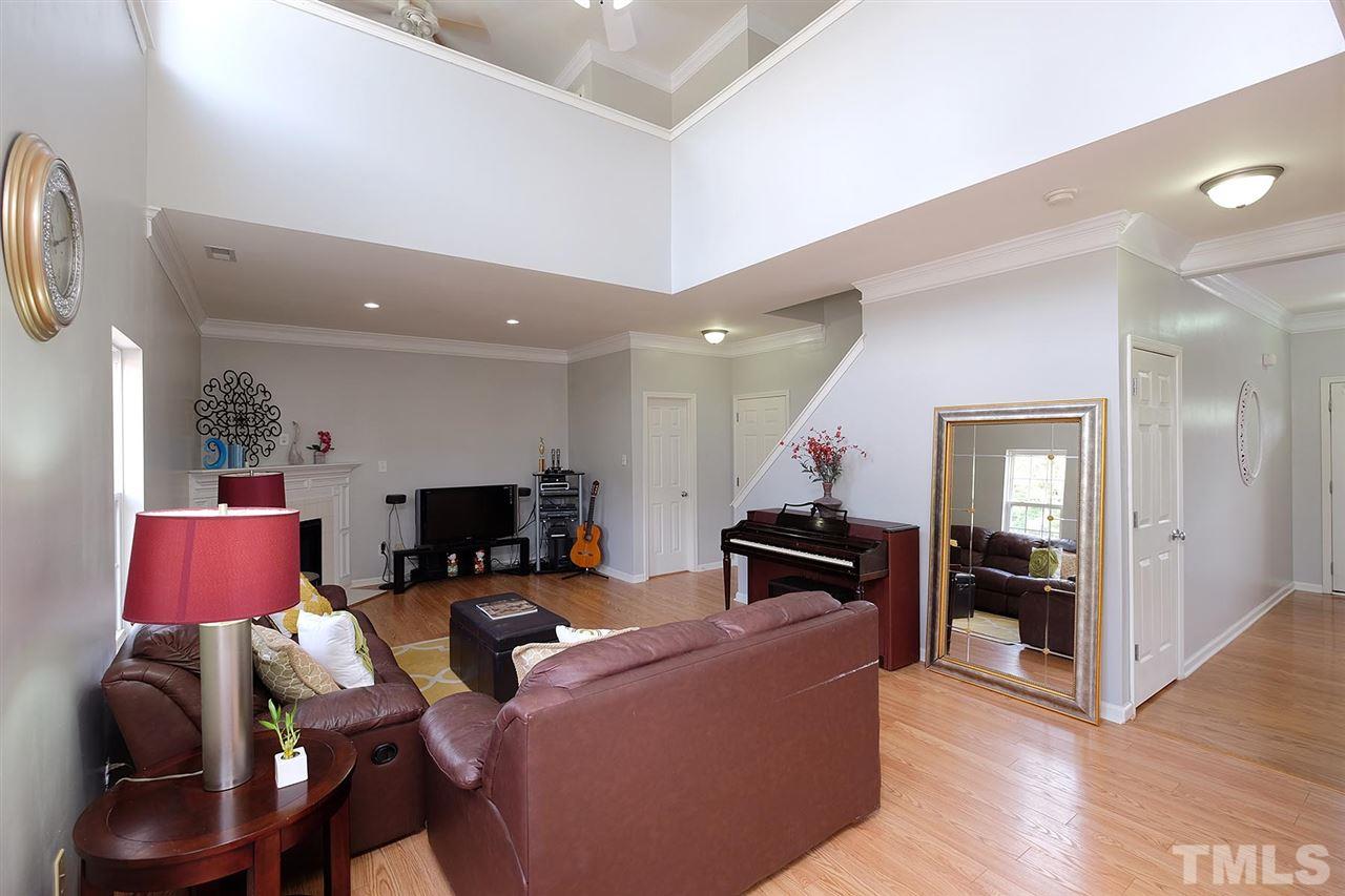 613 Hanson Road Durham, NC 27713 - Photo 8 of 25 a living room with furniture and a flat screen tv