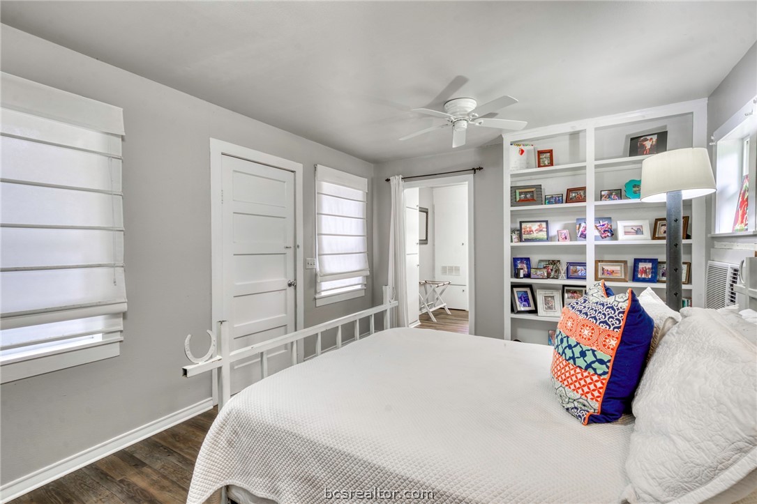 11452 Riley Green Road Franklin, TX 77856 - Photo 13 of 31 a bedroom with a bed and a book shelf