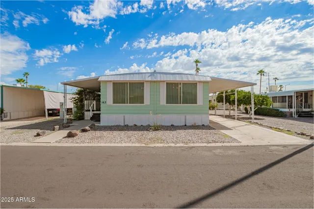 a view of a building with car parked