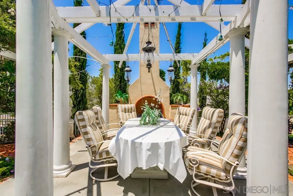 16220 Country Day Road Poway, CA 92064 - Photo 54 of 75 a view of a dining room with furniture wooden floor and chandelier