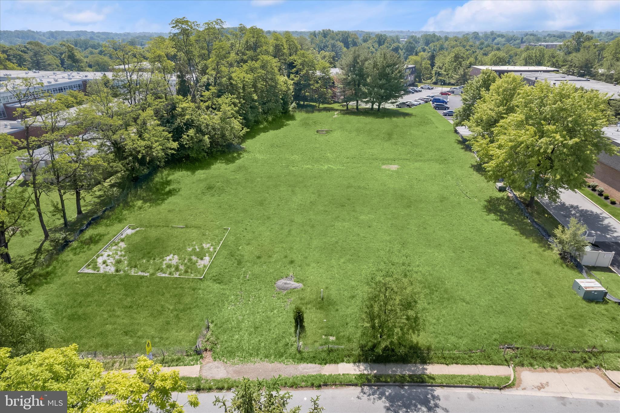 3925 Rolling Rd. Baltimore, MD 21208 - Photo 3 of 27 a view of a lush green outdoor space with a lake view
