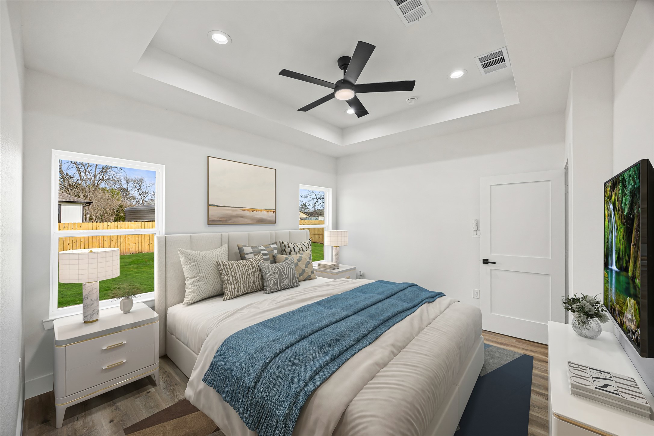 1807 Waco Street Dayton, TX 77535 - Photo 13 of 26 Light-filled primary suite with generous wall space and modern trim details.