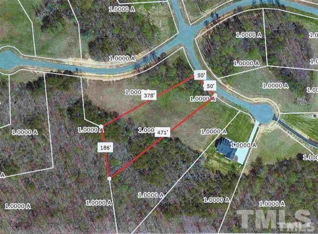 Lot is partially cleared and wooded area