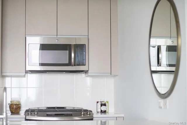 a bathroom with a mirror and a window