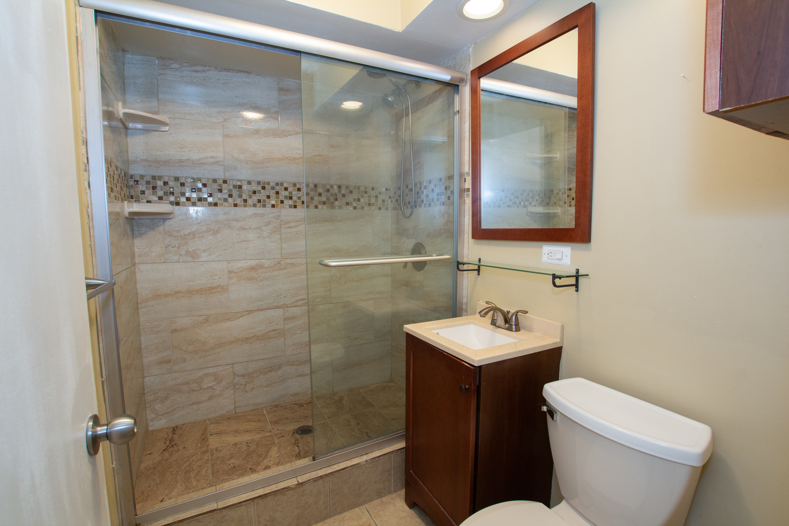 301 Chicago Avenue, Unit 1SW Oak Park, IL 60302 - Photo 10 of 12 a bathroom with a sink mirror toilet and shower