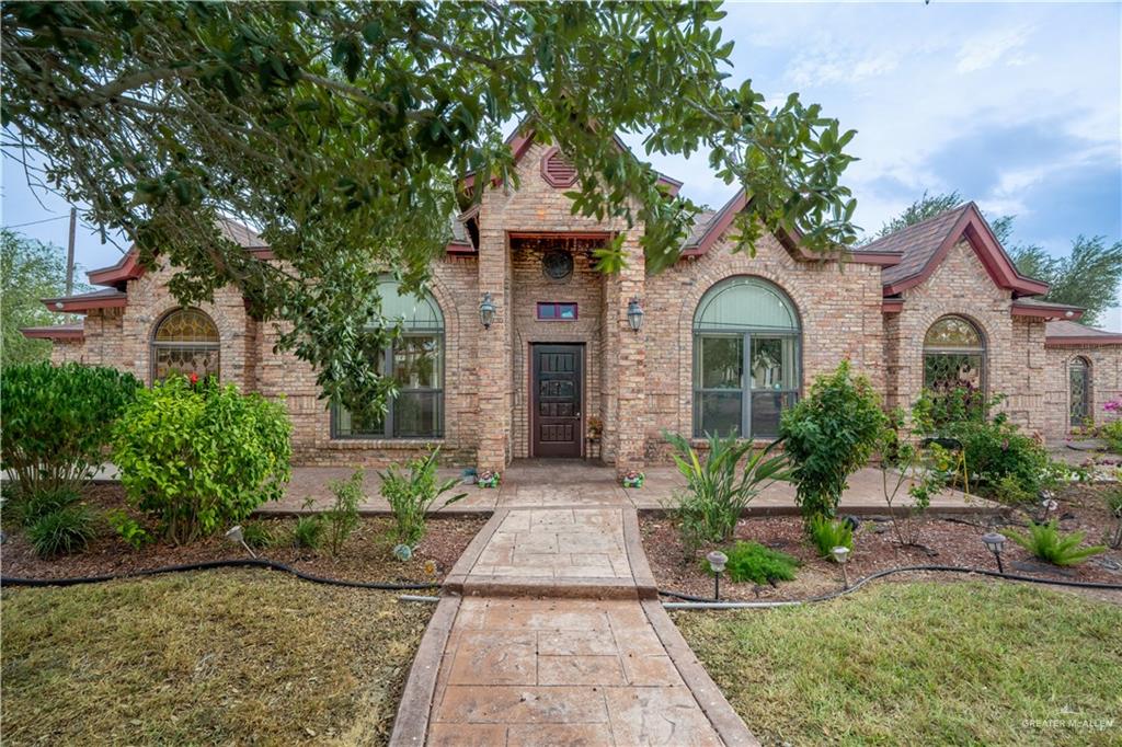 1701 Raul Aguilar Drive Mission, TX 78572 - Photo 2 of 43 a front view of a house with garden