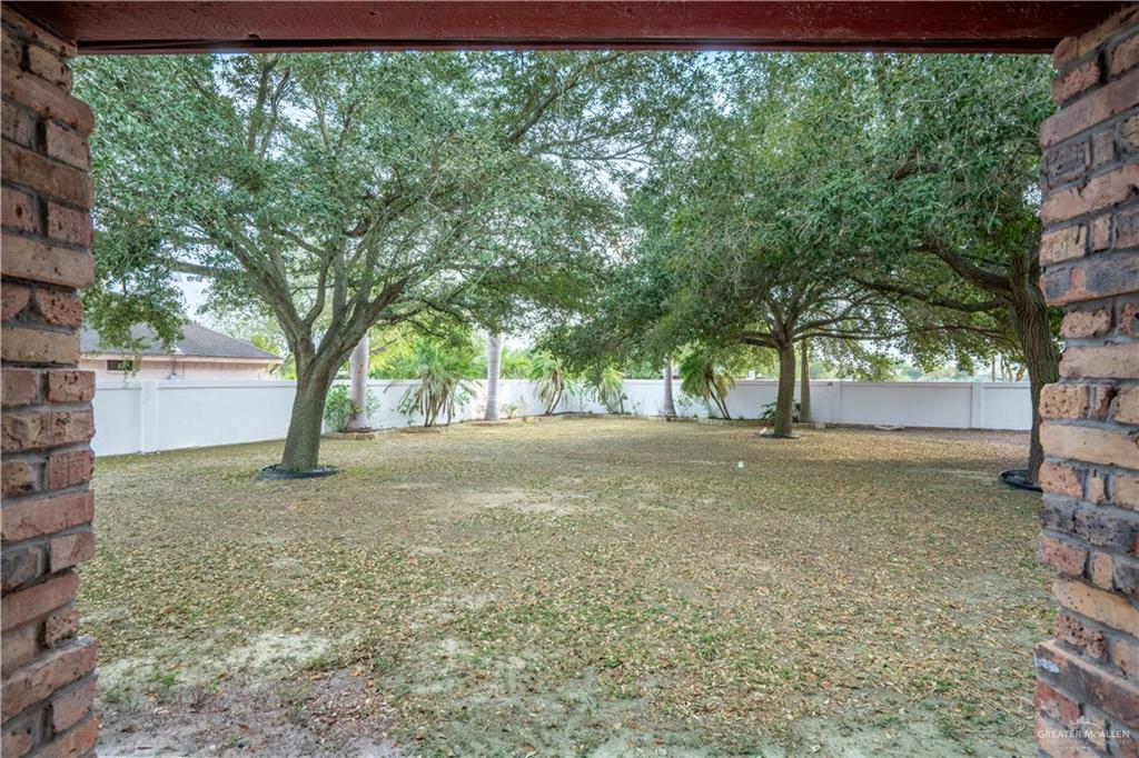 1701 Raul Aguilar Drive Mission, TX 78572 - Photo 23 of 43 a view of a tree in the middle of a yard
