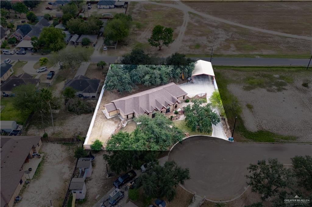 1701 Raul Aguilar Drive Mission, TX 78572 - Photo 36 of 43 an aerial view of a house with a yard and garden