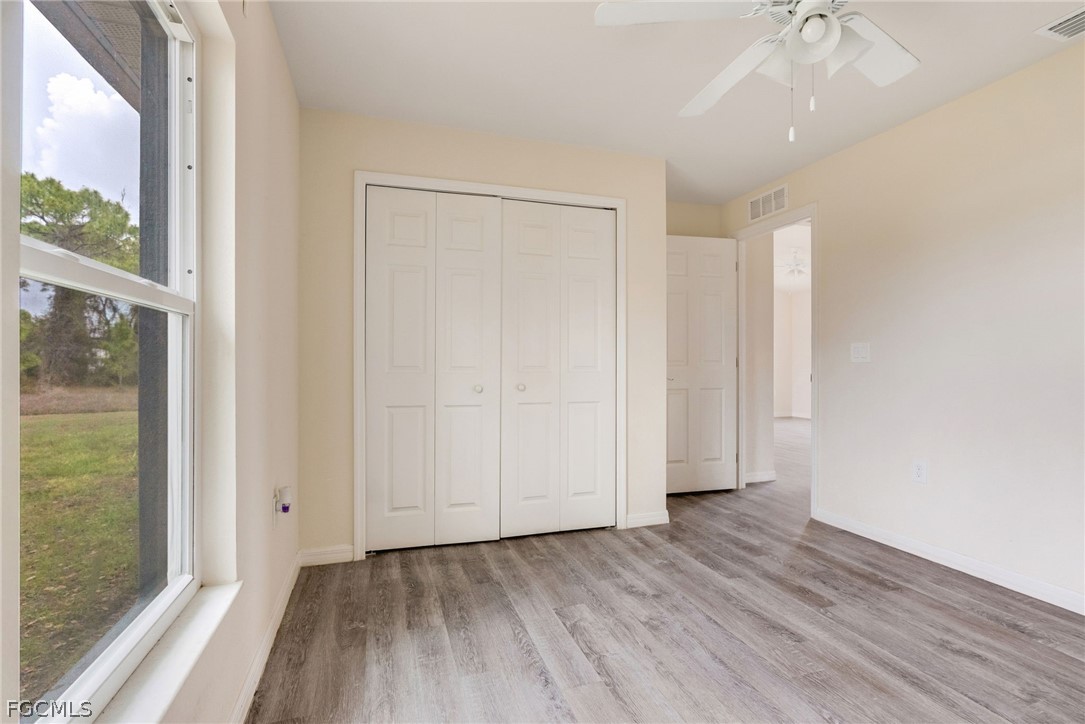 1405 Inwood Road LaBelle, FL 33935 - Photo 21 of 35 a view of entryway with wooden floor