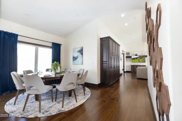 a kitchen with stainless steel appliances granite countertop a sink refrigerator and cabinets