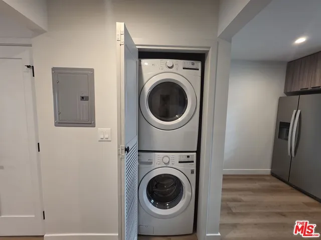 a utility room with sink dryer and washer