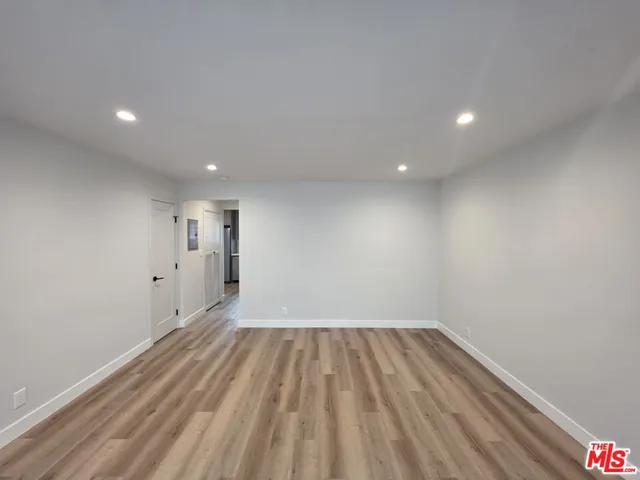 a view of wooden floor in an empty room
