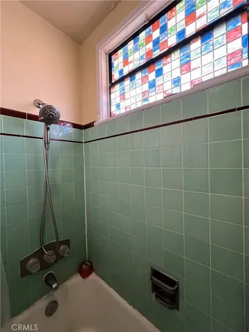 a bathroom with a sink and a shower