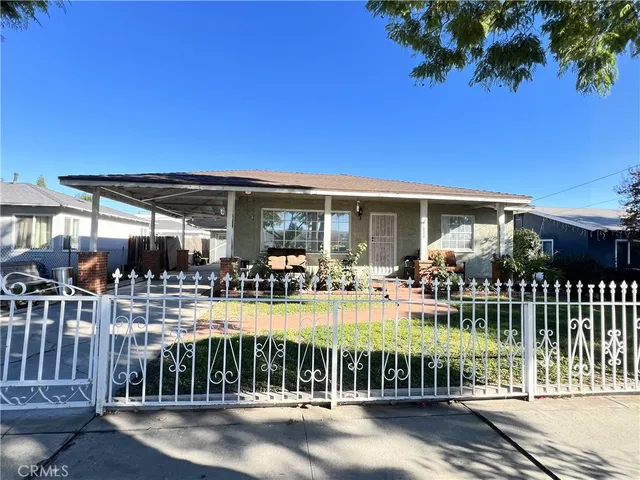 a view of a house with backyard porch and sitting area