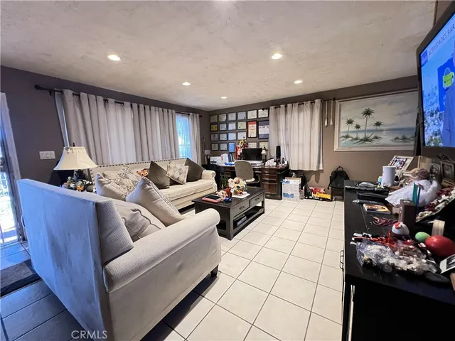 a living room with furniture and a painting