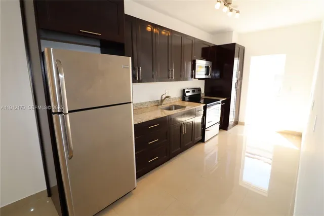 a couple of palm trees in front of a building