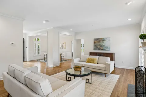 a living room with furniture and a rug