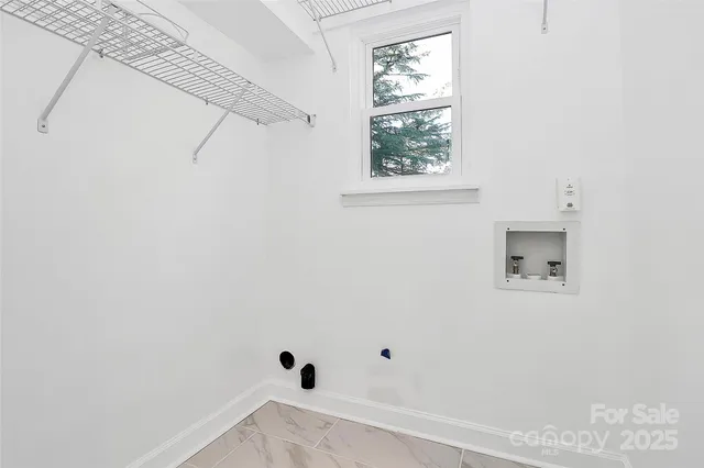 a view of a small space with racks on the wall