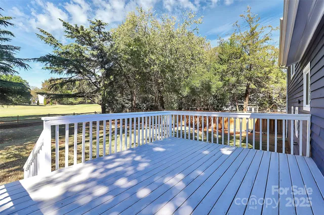 a view of balcony with wooden floor