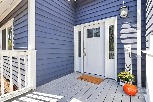 a backyard of a house with outdoor seating