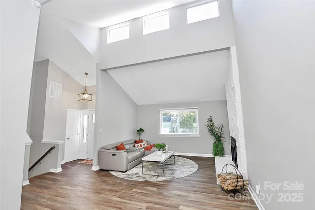 a living room with furniture and a table