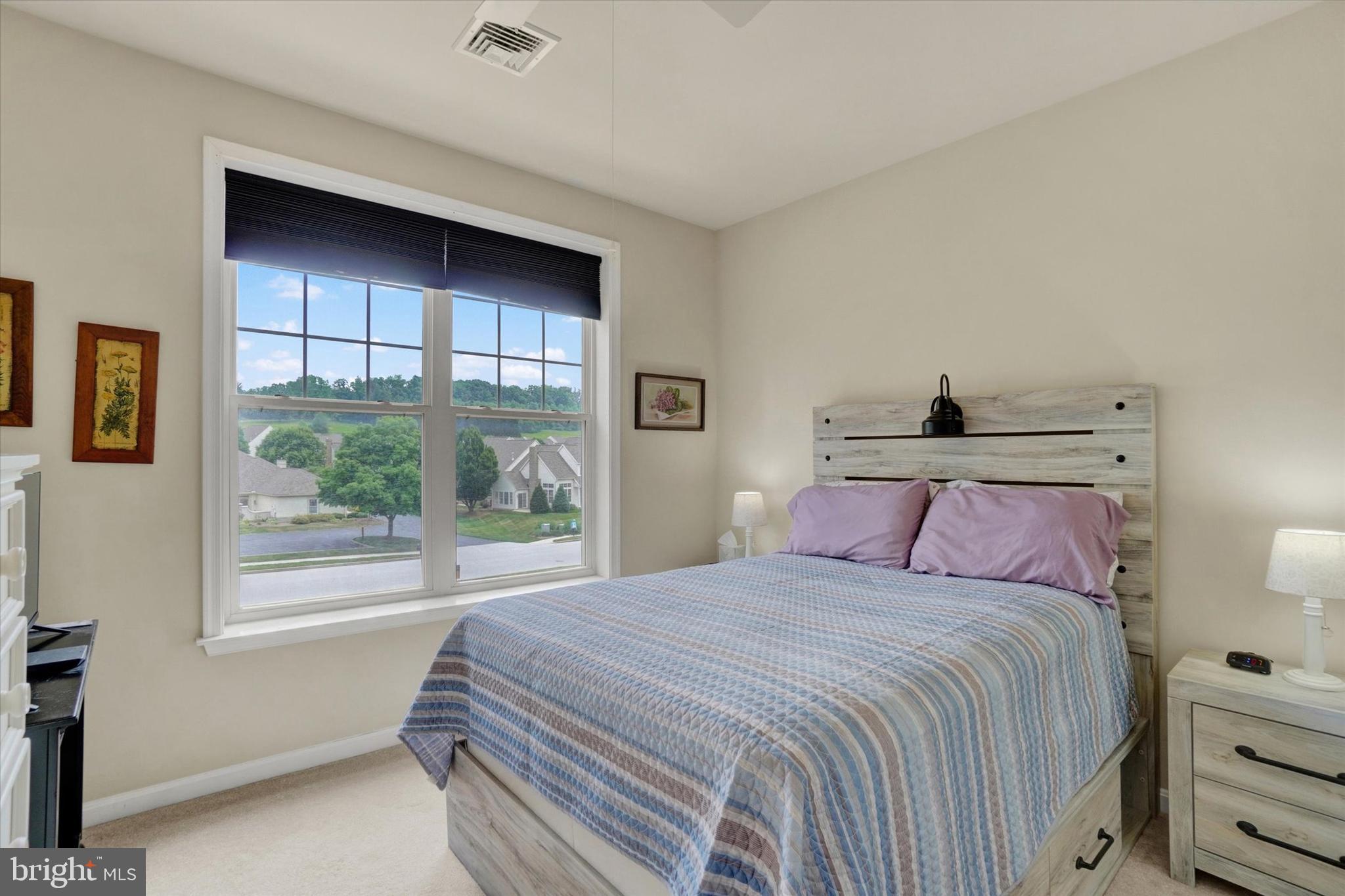 1010 Crest Way, Unit 304 York, PA 17403 - Photo 22 of 24 a bedroom with a bed and a window