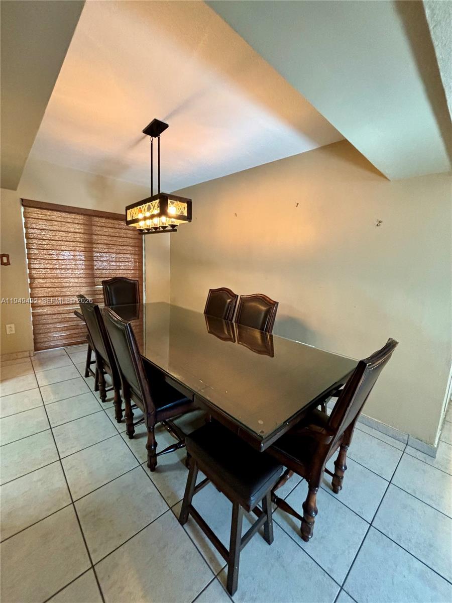 3521 Southwest 88th Court Miami, FL 33165 - Photo 8 of 12 a view of a livingroom with furniture and window