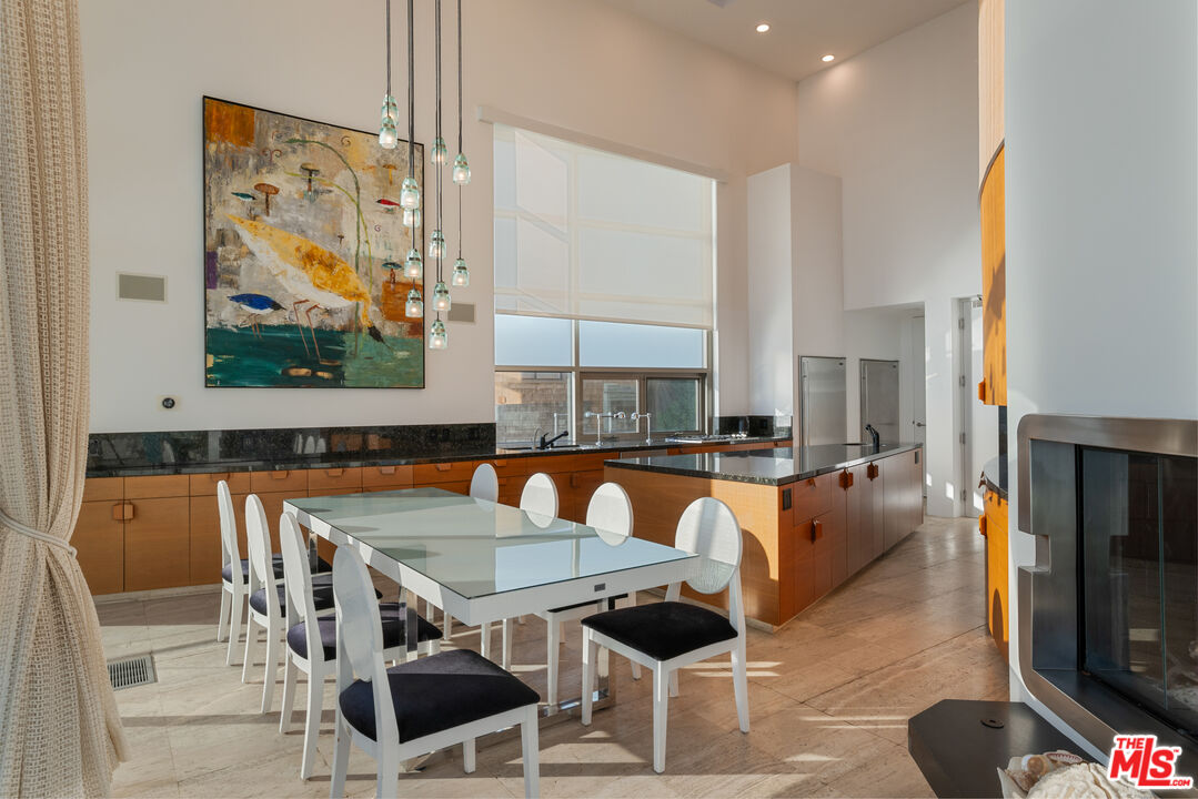 24434 Malibu Road Malibu, CA 90265 - Photo 13 of 29 a view of a dining room with furniture and wooden floor