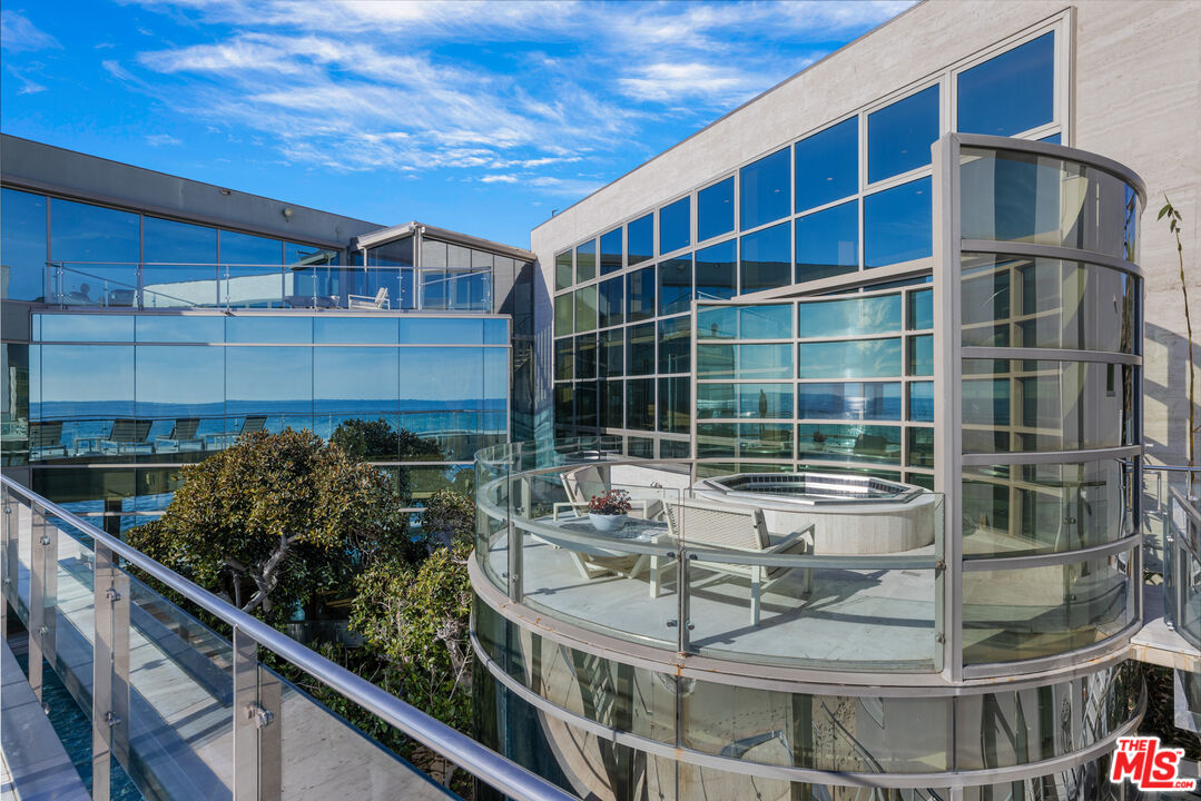 24434 Malibu Road Malibu, CA 90265 - Photo 14 of 29 a view of a balcony with chairs and potted plant