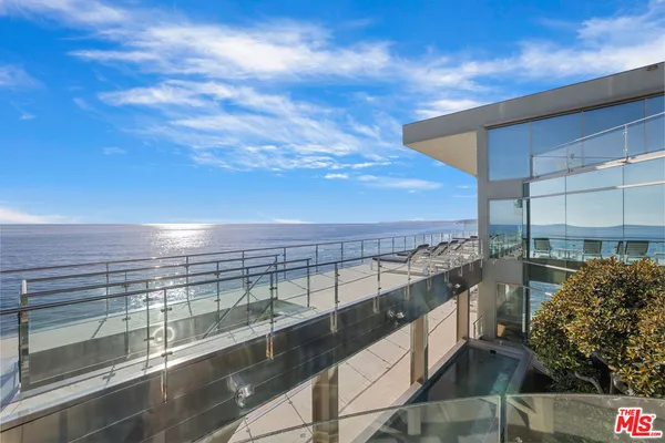 a view of a balcony with an ocean view