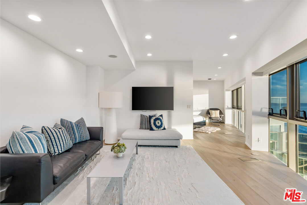 24434 Malibu Road Malibu, CA 90265 - Photo 18 of 29 a living room with furniture and a flat screen tv