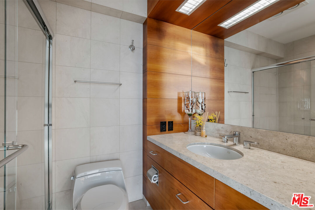 24434 Malibu Road Malibu, CA 90265 - Photo 20 of 29 a bathroom with a granite countertop sink toilet and shower