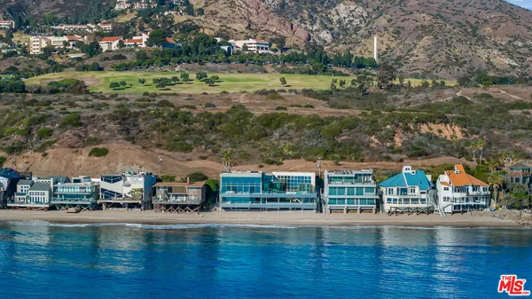 a view of swimming pool with yard and outdoor seating