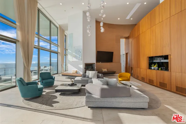 a living room with fireplace furniture and a flat screen tv