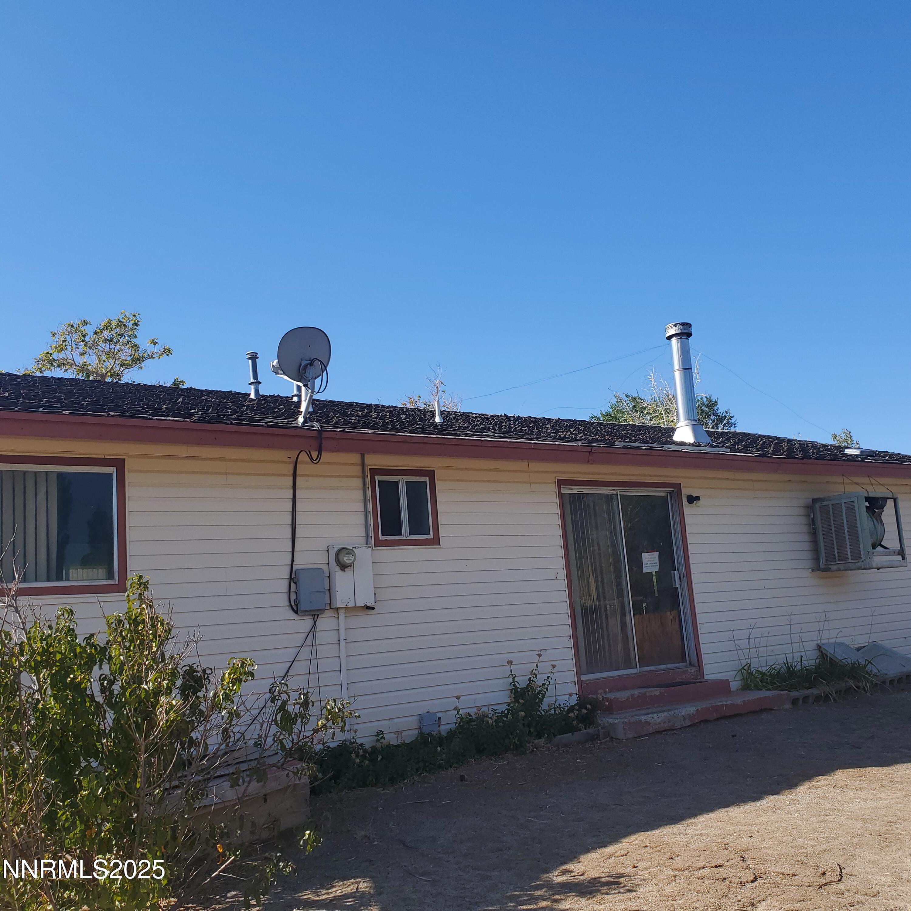 315 Pine Street Hawthorne, NV 89415 - Photo 6 of 6 a front view of a house with a yard
