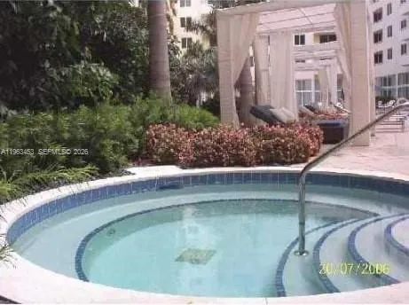 a view of a swimming pool with a yard