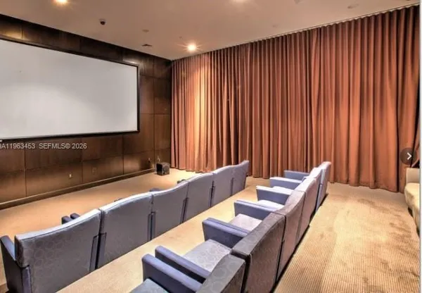 a lobby with furniture and a large window