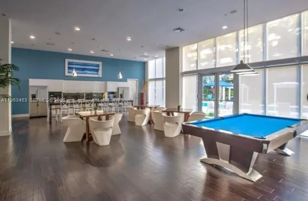 a room with lots of table chair