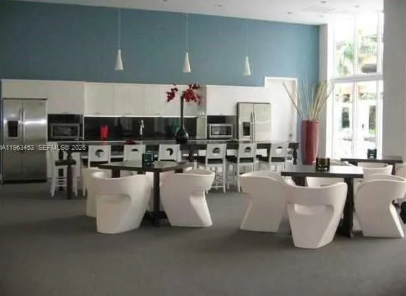 a living room with lots of furniture and appliances