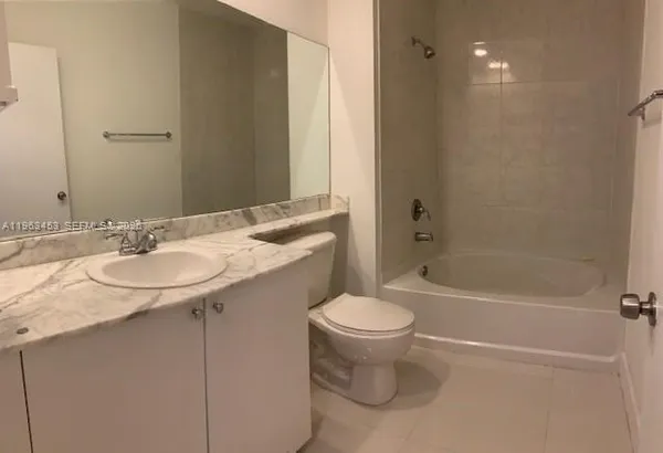 a bathroom with a sink toilet and bathtub