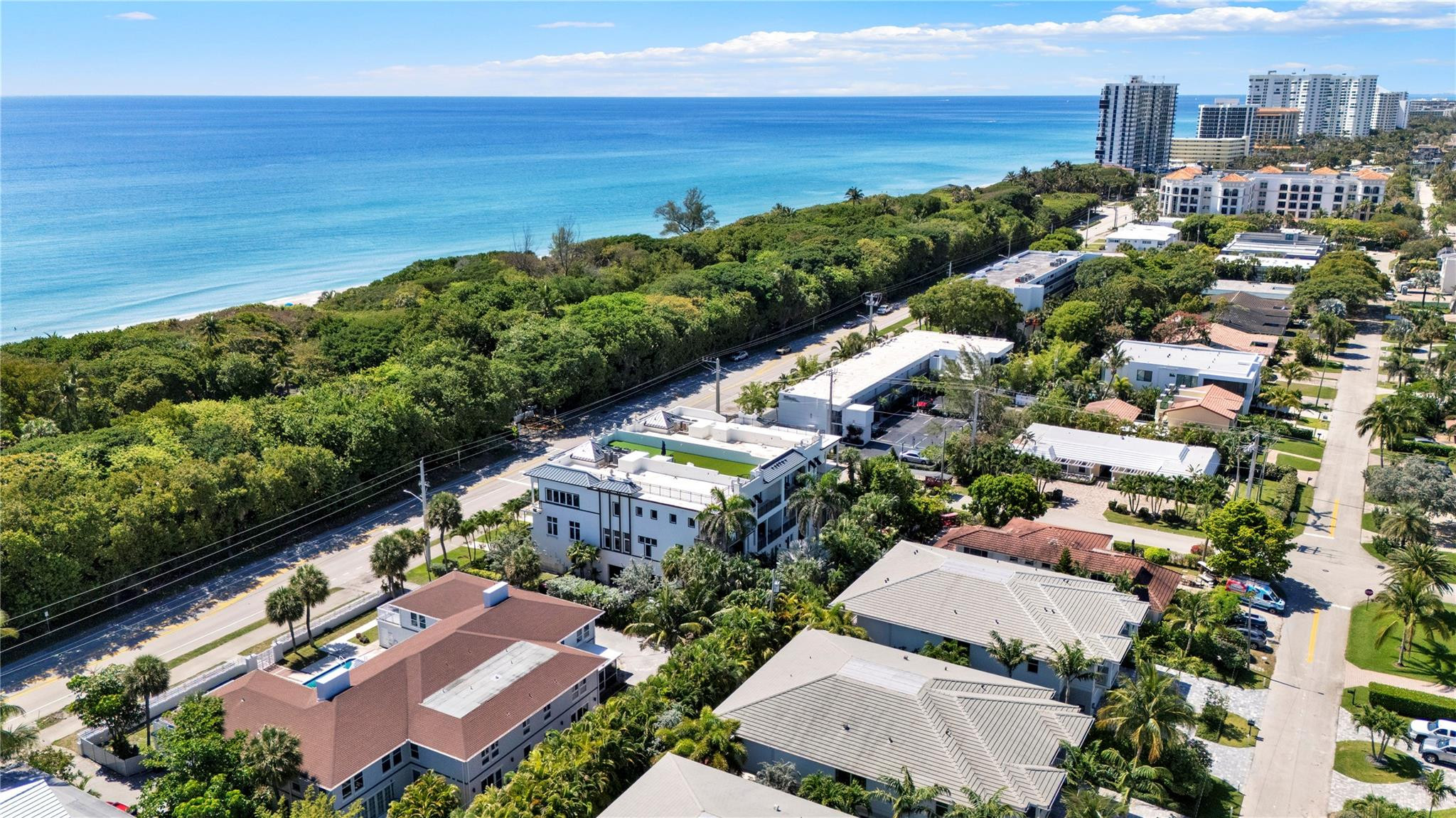 425 North Ocean Boulevard, Unit 3 Boca Raton, FL 33432 - Photo 65 of 69 an aerial view of a city with lots of residential buildings ocean and mountain view in back