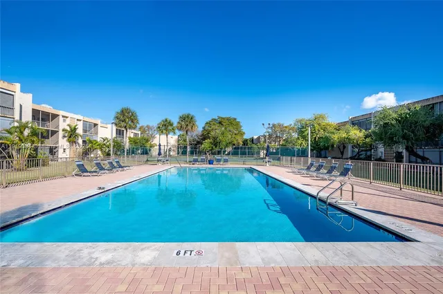 a view of swimming pool from a balcony