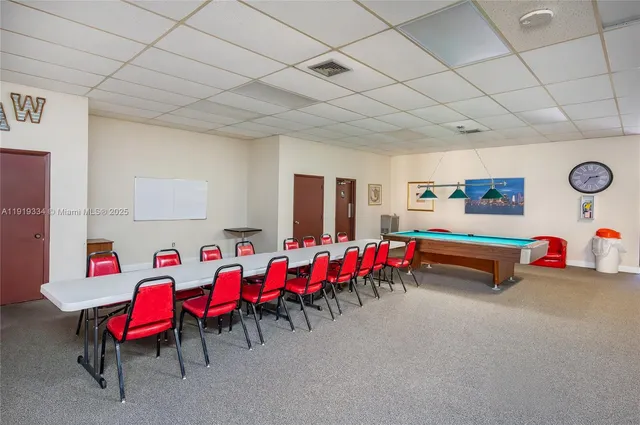 a living room with lots of furniture and a pool
