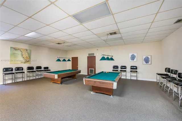 a living room with furniture and white walls