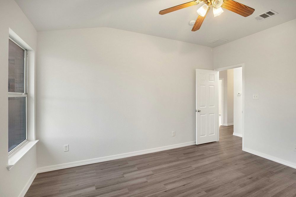 3310 Blue Ridge Drive Round Rock, TX 78681 - Photo 13 of 13 Vast walls and durable flooring define this bright, versatile bedroom.